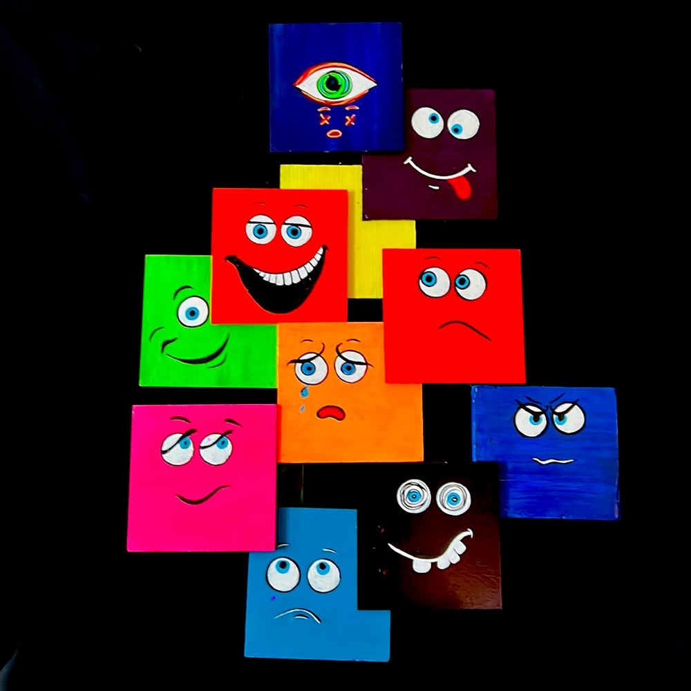 faces was made with wood painted in acrylic with pretty fluorescent colors
